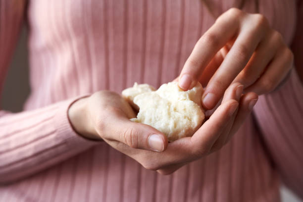 istock Hands holding raw shea butter or karite 1547932385