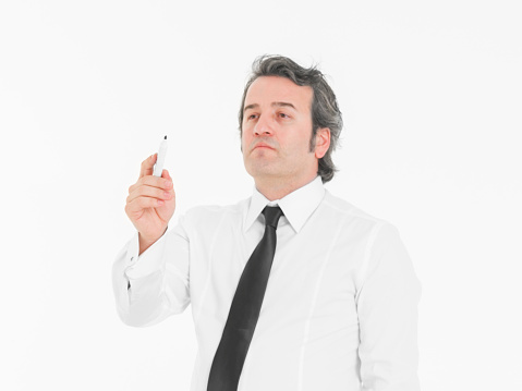 Senior conductor wearing suit. Studio shot.