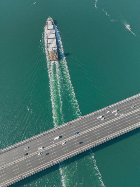 istock Aerial view of a cargo container ship passing under bridge. Istanbul Bosphorus. 1547976571