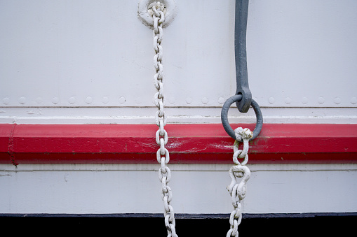 anchor and anchor chain in the harbor of a fishing boat