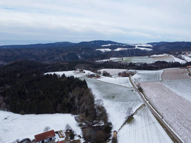 istock winter with agricultural fields covered with snow on a cloudy day 1548031407