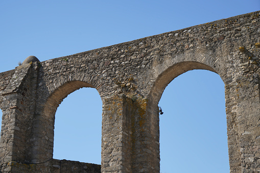 Aqueducts in Portugal are ancient water pipes reminiscent of stone bridges