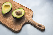 Avocado on a cutting board, healthy food concept.