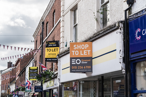 Stone, Staffordshire, England, July 13th 2023. Shop to let signs on town center stores, property, economy and editorial travel illustration.