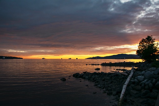A view from a beach in Vancouver, at dusk.