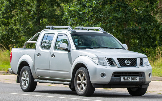 Milton Keynes, UK - July 16th 2023: 2012 NISSAN NAVARA  car driving on an English road