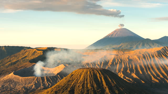 4k Timelapse Movie Sunrise Scene of Moving Cloud, Fog and Smoke of Eruption Cover Volcano Mts. Bromo, Semeru, Batok and Widodaren, Tengger Caldera, Indonesia