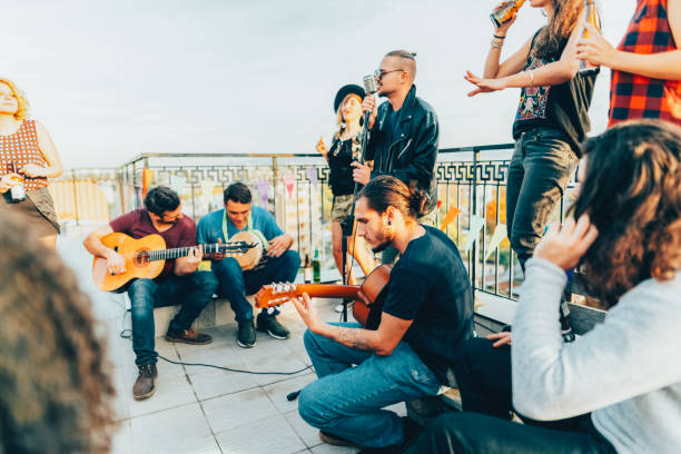 istock Friends drinking and partying on the rooftop 1548199002