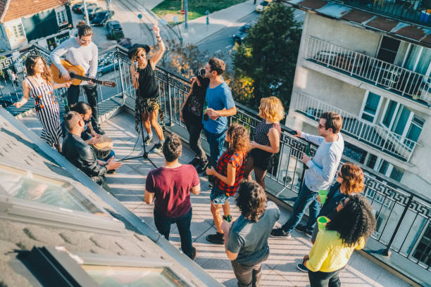 istock Friends drinking and partying on the rooftop 1548200658