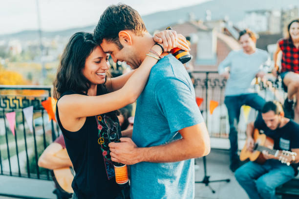 friends drinking and partying on the rooftop - individual event women people autumn imagens e fotografias de stock