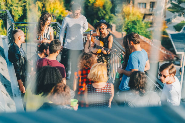 istock Friends drinking and partying on the rooftop 1548202772