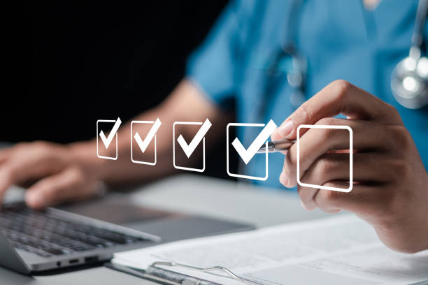 doctor fills out the medical survey paperwork and checking mark on checkboxes. - checkbox check mark questionnaire checklist imagens e fotografias de stock