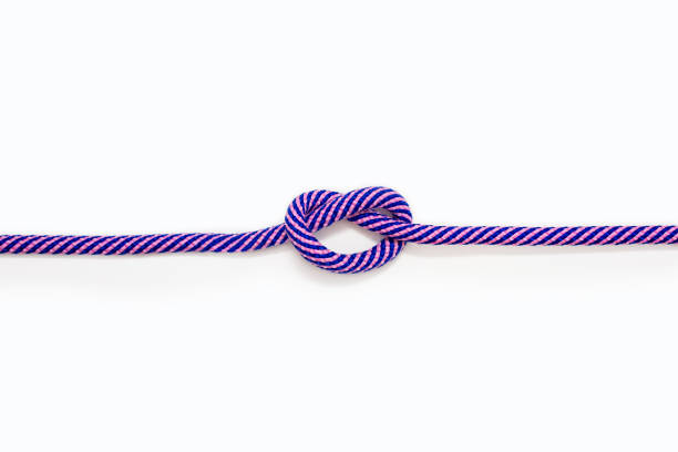 istock Multicolored blue-pink rope with a knot on a white background 1548230777