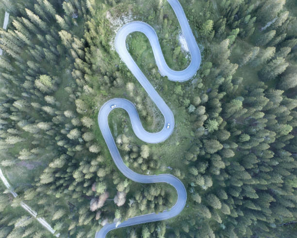 istock mountain road in the forest with hairpin bends view from above 1548247445