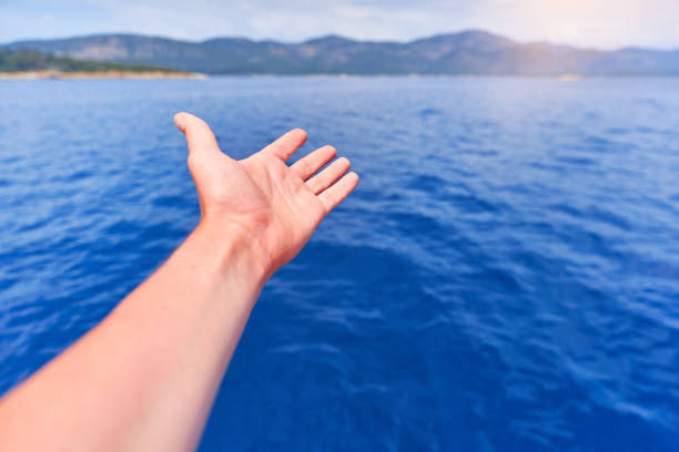 istock Person inspired by the blue sea 1548247983