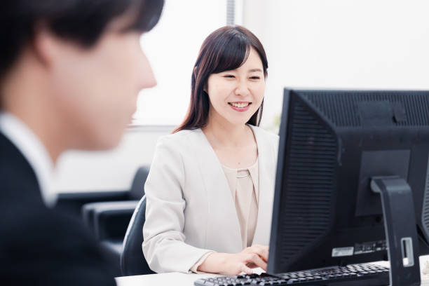 istock An office worker working in an office with a smile 1548256924