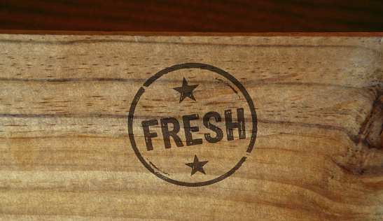 Fresh stamp printed on wooden box. Eco natural and organic product concept.