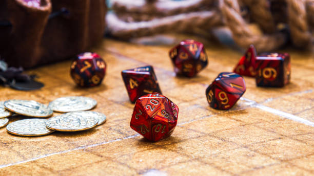 istock Red RPG dice and golden gaming coins on a battle map 1548267917