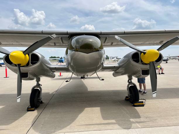 istock Front view of small propeller plane against blue sky and clouds 1548283460