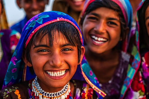Group of happy Gypsy Indian children - desert village, Thar Desert, Rajasthan, India.