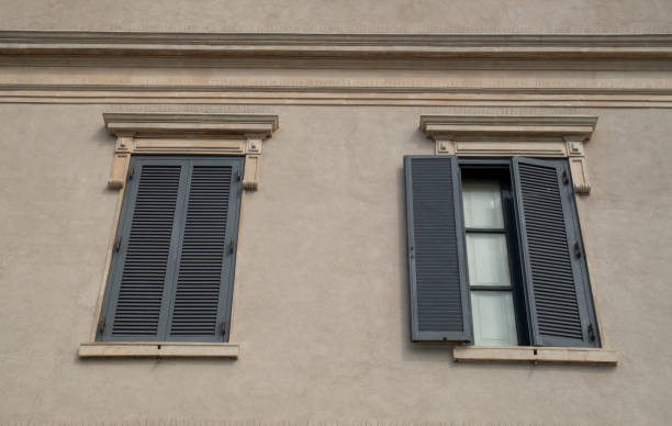 istock Traditional wooden shutter  as blinds on two windows in Italy 1548290400