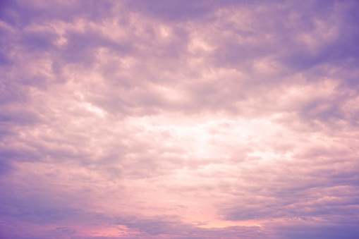 Purple clouds on a summer day. Fantasy and dreams in Nature.