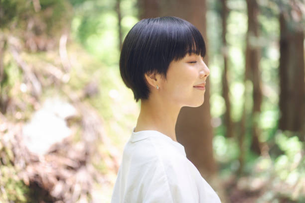 istock Woman walking in the woods. 1548386654