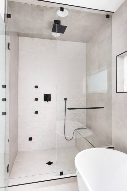 istock A brown tiled walk-in shower and freestanding bathtub. 1548394821