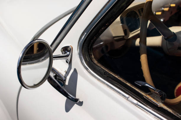 istock Chrome rearview mirror on a white retro car. 1548395343