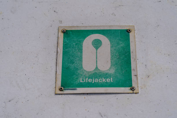 istock Green sign for a lifejacket, on a boat. Safety measures 1548410236