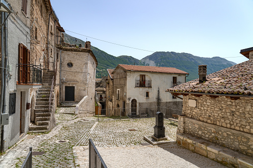 Stone exterior of old buildings with flowers on the streets of Eze Village, picturesque medieval city in South of France along the Mediterranean Sea