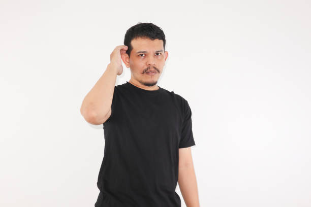 istock Worries face expression of Asian man who got problem, scratching his head, isolated on white. 1548475897