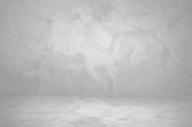 istock bright white concrete room background. white plaster stucco wall and floor interior background used as product displayed, mock up, template for advertising. pedestal or stage backdrop. 1548489378