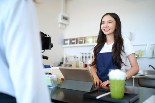 istock Women in coffee shop. 1548512432