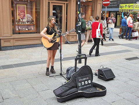 7th July 2023, Dublin, Ireland. Street entertainer busker called Ajbecovering on Grafton Street in Dublin city centre.