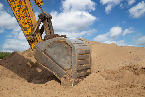 Excavator. The excavator is working on loading sand. Special equipment is used for construction.