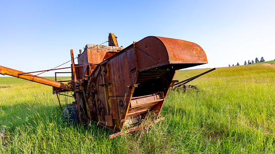 Combine rusting in the environment on a farm field