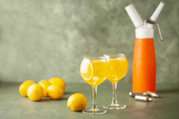 istock Homemade Lemonade in glass. Soda Drinks Carbonate Oxide lemonade liquid make by CO2 Siphon Dispensder bottle. 1548592059