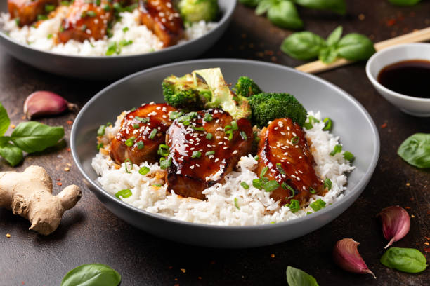 Teriyaki Pork Belly with broccoli, spring onion and rice Teriyaki Pork Belly with broccoli, spring onion and rice. sticky sesame chicken sauces stock pictures, royalty-free photos & images