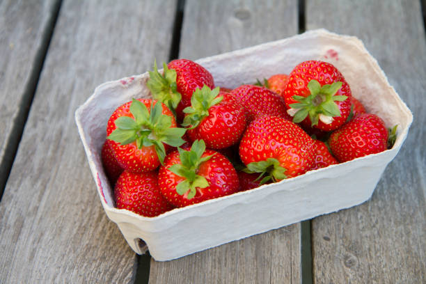 istock Strawberry fruits in a punnet 1548677266