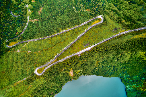Aerial top view picturesque paradise of Sete Cidades in Azores, Sao Miguel. Volcanic craters, stunning lakes and winding road. Ponta Delgada, Portugal. Natural wonders, landmarks, tourist attractions