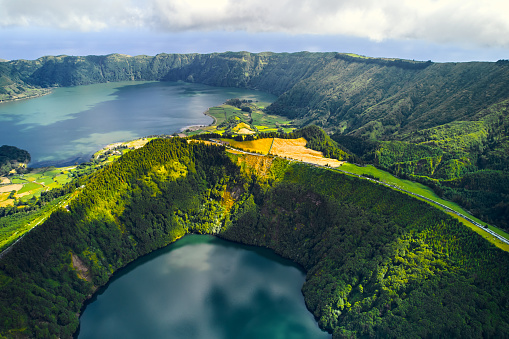 Aerial shot, drone point of view, Boca do Inferno. Picturesque lakes in volcanoes craters. San Miguel, Ponta Delgada island, Azores, Portugal. Bird eye view. Landmarks and natural wonders concept
