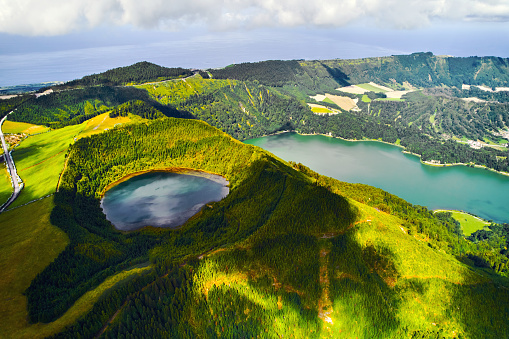 Aerial shot, drone point of view, Boca do Inferno. Picturesque lakes in volcanoes craters. San Miguel, Ponta Delgada island, Azores, Portugal. Bird eye view. Landmarks and natural wonders concept