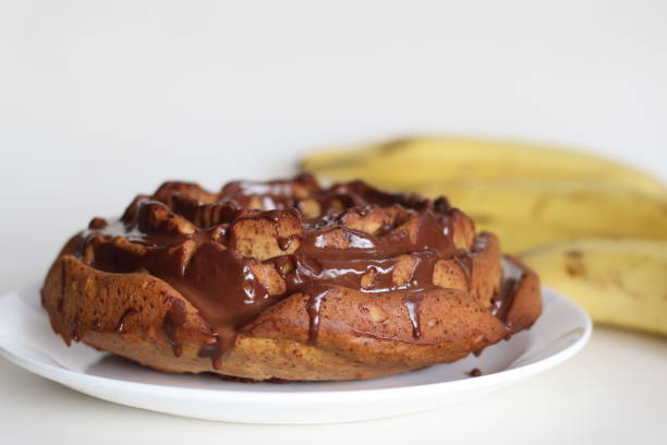istock Rose shaped whole wheat plantain cake topped with chocolate sauce. 1548694278