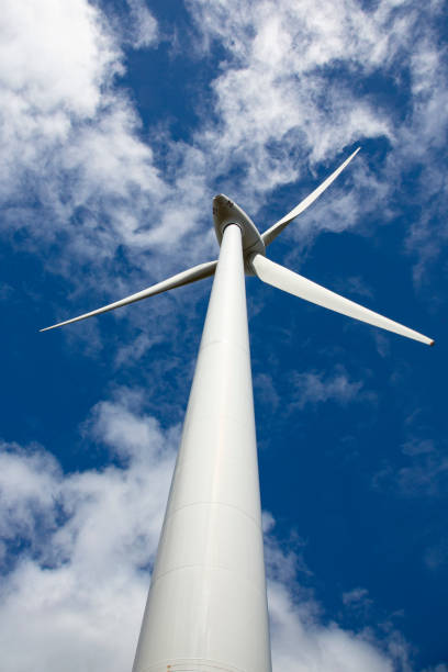 Upward view of giant wind turbine generator stock photo