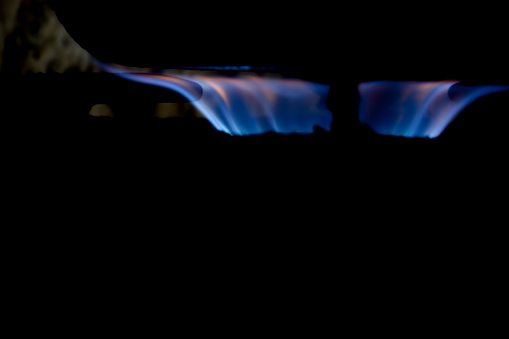 A flame on a gas stove while cooking.