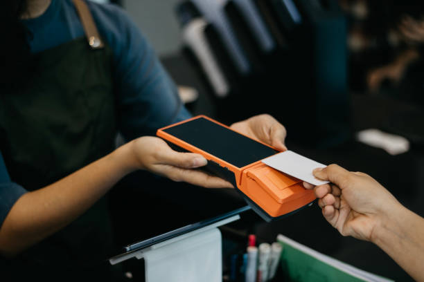 istock Close up Paying Using Contactless Card and Terminal Payment 1548767592