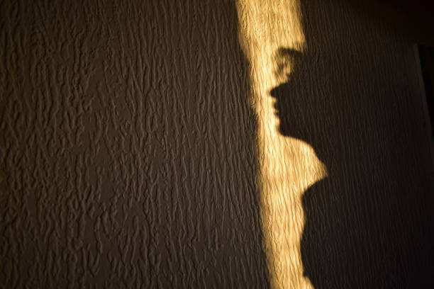 istock silhouette of a person on a wall 1548770270