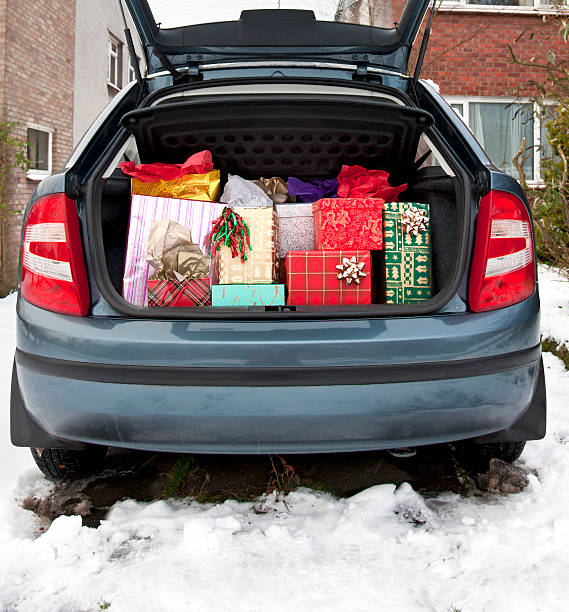istock Car boot, filled with Christmas presents, snow underfoot 154881984