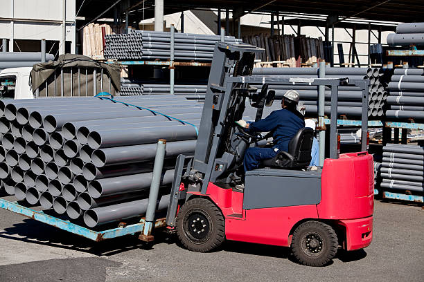 Working man using the fork lift stock photo